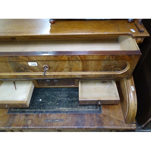 1459 - A 19th century Biedermeier desk in figured mahogany fitted with a tambour front, with drawer and cup... 