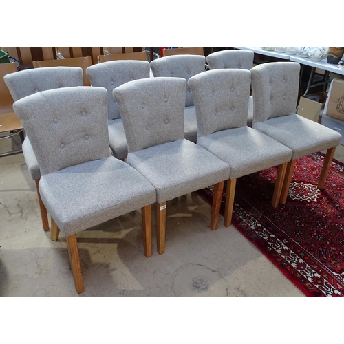 1460 - A set of 8 good quality modern dining chairs, with upholstered button backs, on oak tapered legs