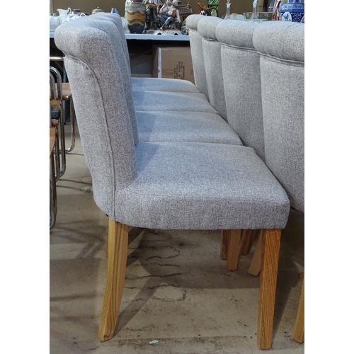 1460 - A set of 8 good quality modern dining chairs, with upholstered button backs, on oak tapered legs