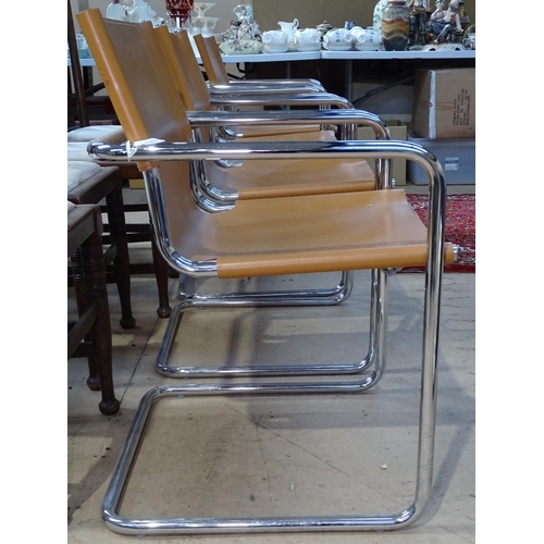 1461 - A set of 4 Matteo Grassi chrome cantilever armchairs, with saddle brown leather seats, with impresse... 