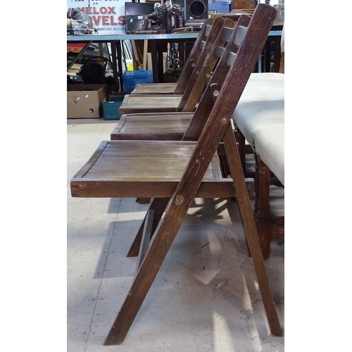 1463 - A set of 4 stained wood folding chairs