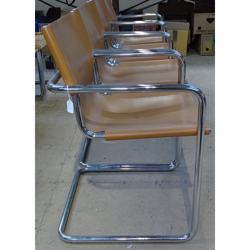 1465 - A set of 4 Matteo Grassi chrome cantilever armchairs, with saddle brown leather seats, with impresse... 