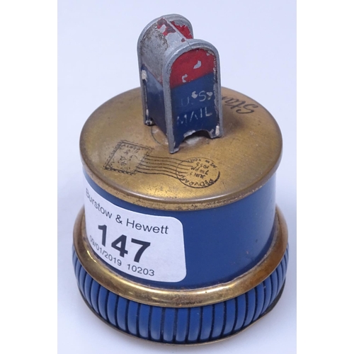 147 - An American brass and enamel desktop stamp holder