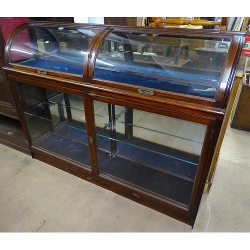 1471 - A Victorian mahogany framed shop display cabinet, the top having 2 bow-glazed rising doors with glaz... 