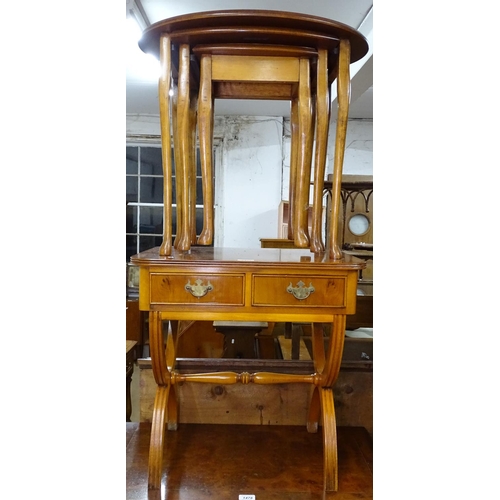 1477 - A reproduction yew wood side table, with 2 frieze drawers, on yoke supports, and an oval nest of 3 t... 