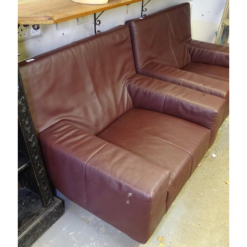 1507 - A burgundy leather club chair, on flat bar steel legs