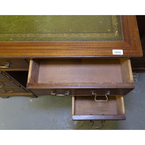 1515 - A reproduction mahogany Queen Anne style knee-hole writing desk, with fitted drawers and recessed cu... 