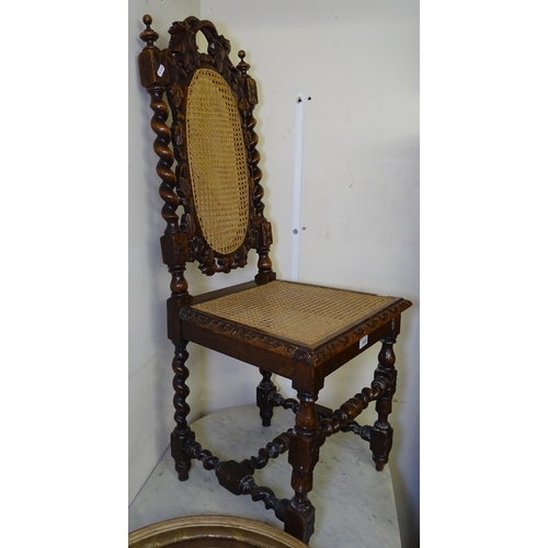 1520 - A Victorian carved oak Carolean style hall chair with cane panels