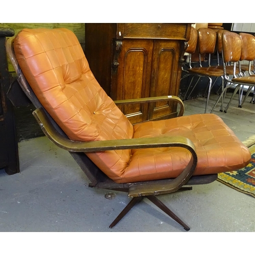 1540 - A mid-century low swivel armchair with bentwood arms, on star-shaped base