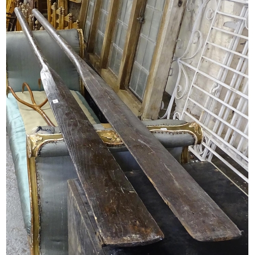 1560 - A pair of large stained teak oars, L340cm