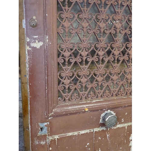 1563 - A French painted front door, with a pierced metal panel, H211cm, W86cm