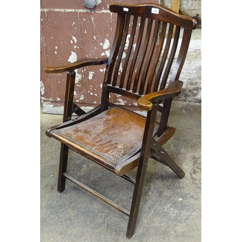 1564 - An Edwardian stained beech folding armchair