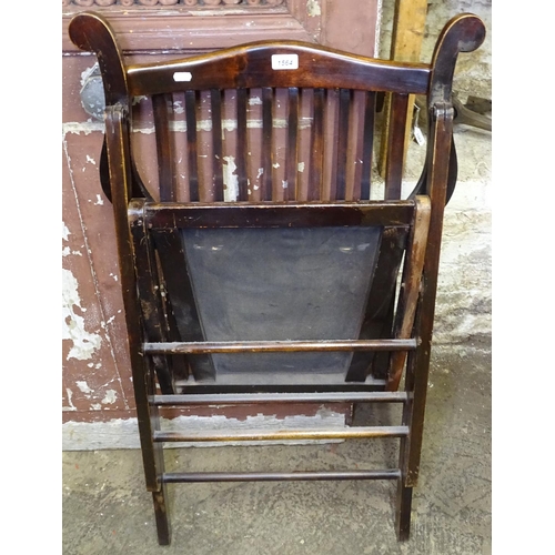 1564 - An Edwardian stained beech folding armchair