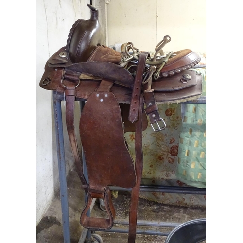 1587 - A full size leather western saddle, and a pair of horse hames