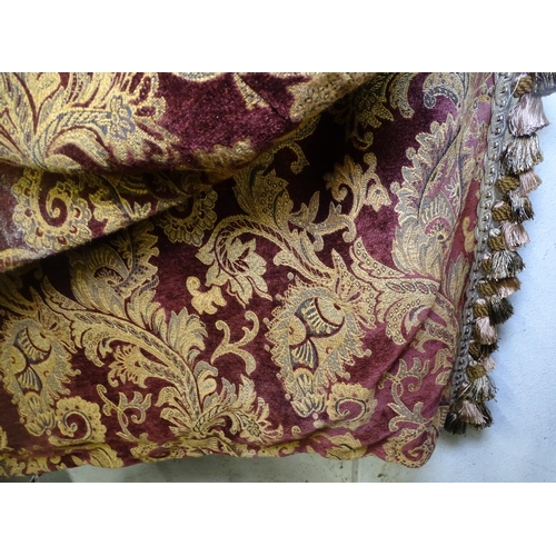 1589 - A pair of heavy gold and red velvet lined curtains