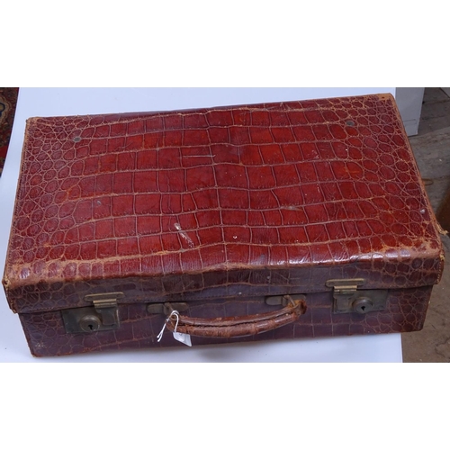 159 - A Vintage leather suitcase with lined interior and brass locks, length 19.5