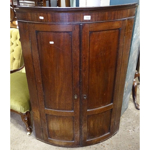 1590 - A George III mahogany hanging corner cupboard, with 2 panel doors and fitted shelves