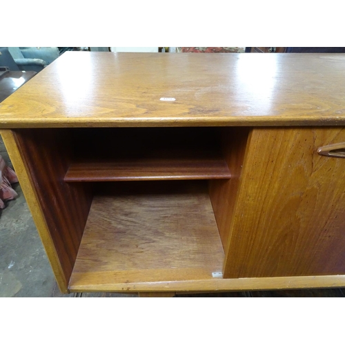 1598 - A mid-century teak sideboard, fitted with drawers and sliding cupboard doors, L127cm