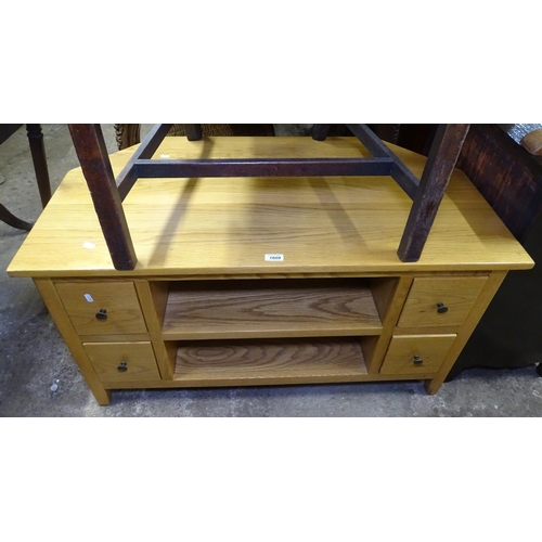 1609 - A modern polished oak TV stand, W108cm