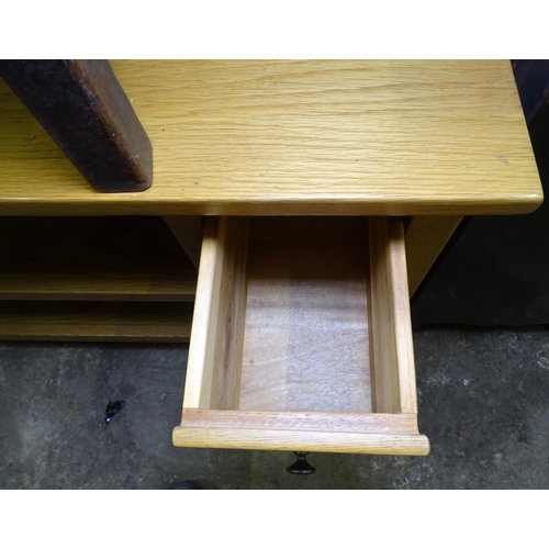 1609 - A modern polished oak TV stand, W108cm