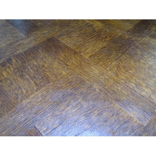 1612 - A French oak parquetry draw leaf dining table, on cabriole legs, L150cm