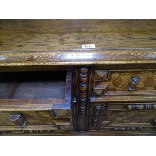 1645 - An ornate Continental oak and cube marquetry decorated sideboard, with raised panelled back, drawers... 