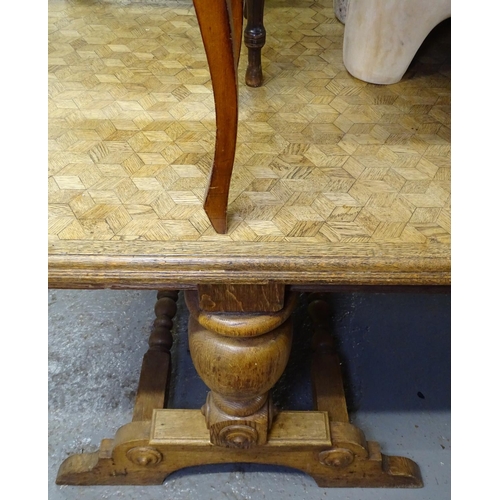 1647 - A Continental oak and cubed parquetry top dining table, raised on baluster turned legs, and bobbin t... 