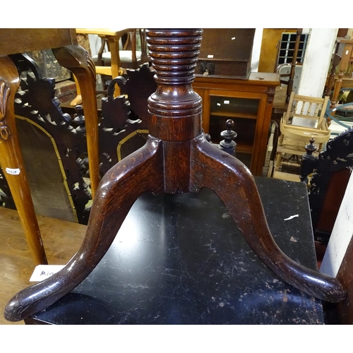 1658 - A Georgian oak tilt-top wine table, on ring turned column and tripod base