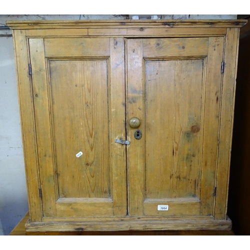 1664 - A small Antique pine cabinet, with 2 panelled doors, W76cm, H73cm