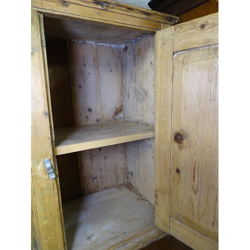 1664 - A small Antique pine cabinet, with 2 panelled doors, W76cm, H73cm