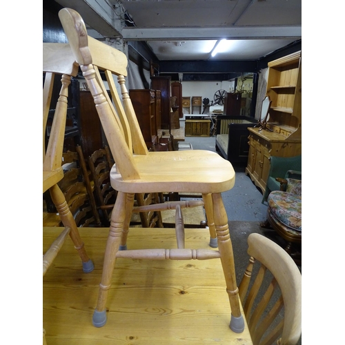 1666 - A rectangular pine farmhouse kitchen table, with a single end frieze drawer, on baluster legs, L167c... 