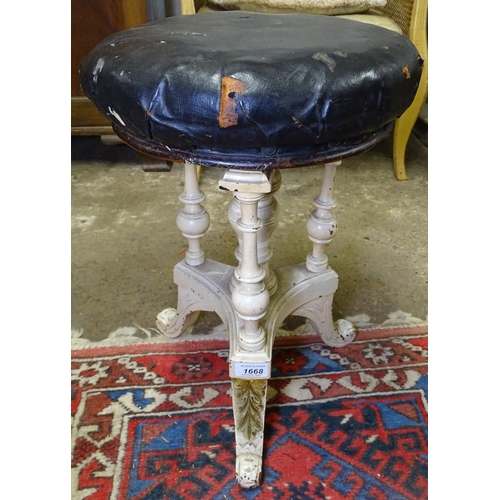 1668 - A Victorian painted revolving piano stool