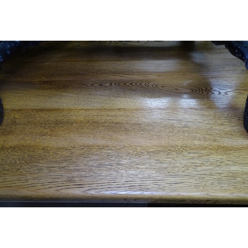 1671 - A 1920s rectangular oak refectory table, on tablet end base, L167cm