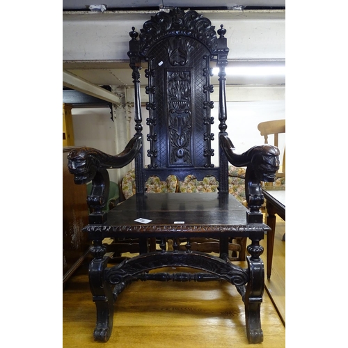 1672 - An ornate Victorian carved and panelled oak elbow-chair, with carved arms on scrolled supports, W50c... 