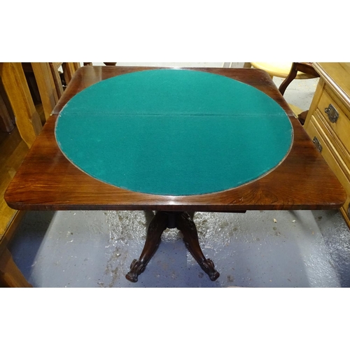 1677 - A Regency rosewood fold over card table, with applied moulded decoration, raised on a centre column ... 