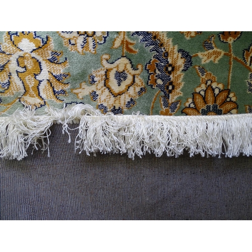 1678 - A green ground Keshan carpet, 280cm x 200cm