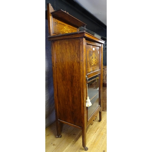 1689 - A Victorian rosewood music cabinet, with raised panel back, marquetry inlaid decoration, and glazed ... 