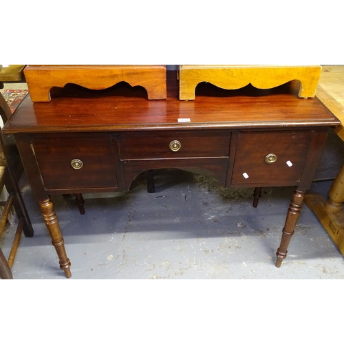 1693 - An early 19th century mahogany knee-hole writing desk, with 3 short drawers, raised on turned legs, ... 