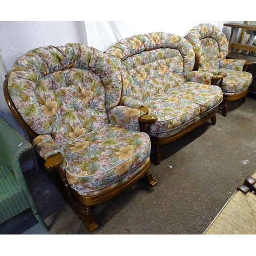 1699 - An Ercol cottage 3-piece suite, comprising of a 2-seater settee and a pair of matching armchairs, wi... 