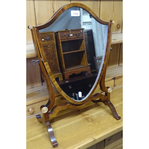 1702 - A 19th century mahogany shield-shaped swing toilet mirror