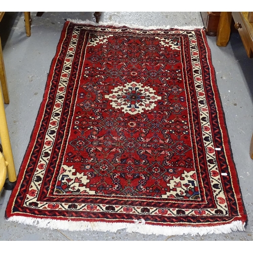 1716 - A red ground Bokhara rug, 160cm x 95cm