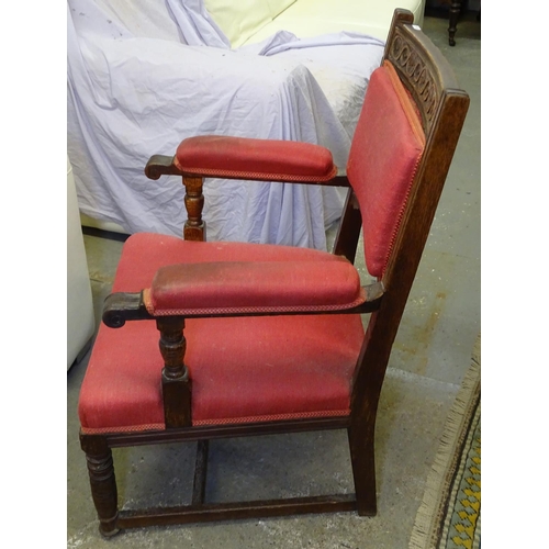 1721 - A carved oak upholstered open-arm chair, on turned legs