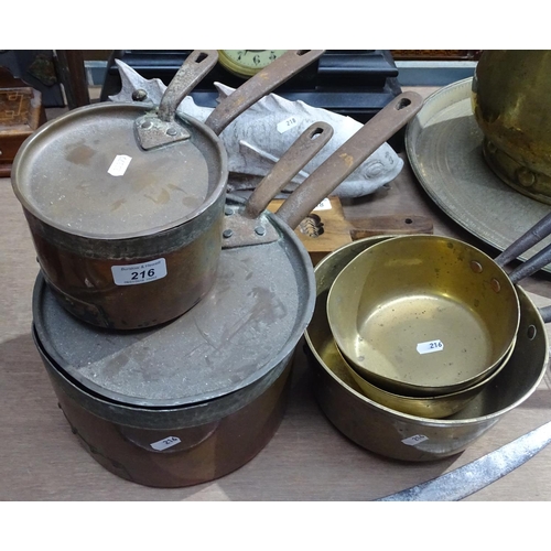 216 - 3 Antique brass pans with iron handles, and 2 copper pans with lids