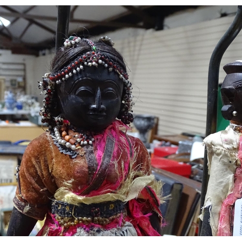 248 - A pair of table lamps, modelled as carved wood Eastern figures in original dress, height 18