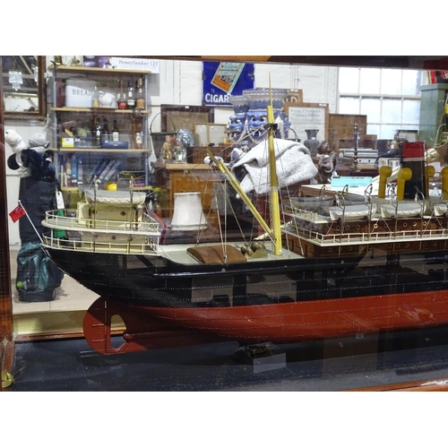 285 - A large scratch-built model of the S.S. Carolan, London, in glazed mahogany display case, length ove... 