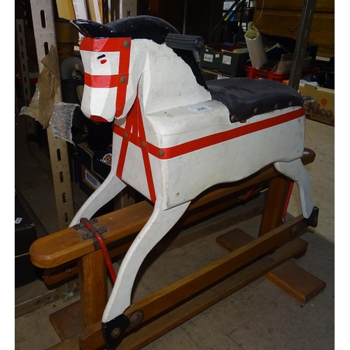 296 - A carved and painted wooden rocking horse on stand, height 262