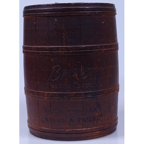 299 - An Antique carved pine container, inscribed Briggs Smoking Tobacco Aged in the Wood, height 7.25