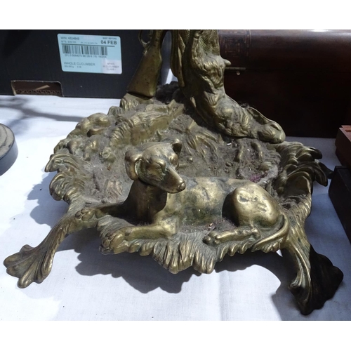 305 - A cast-brass stick stand with dog figure