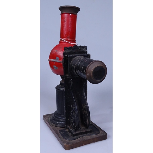 310 - An Antique painted tin slide viewer, height 10.5