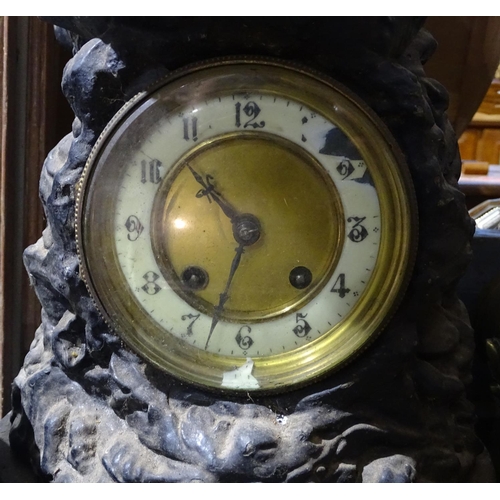 334 - A clock surmounted by a patinated spelter seaman figure, height 29